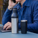 Cupple reusable water bottle and insulated reusable cup black in use at desk