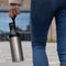 Cupple reusable water bottle being carried using recycled carry loop